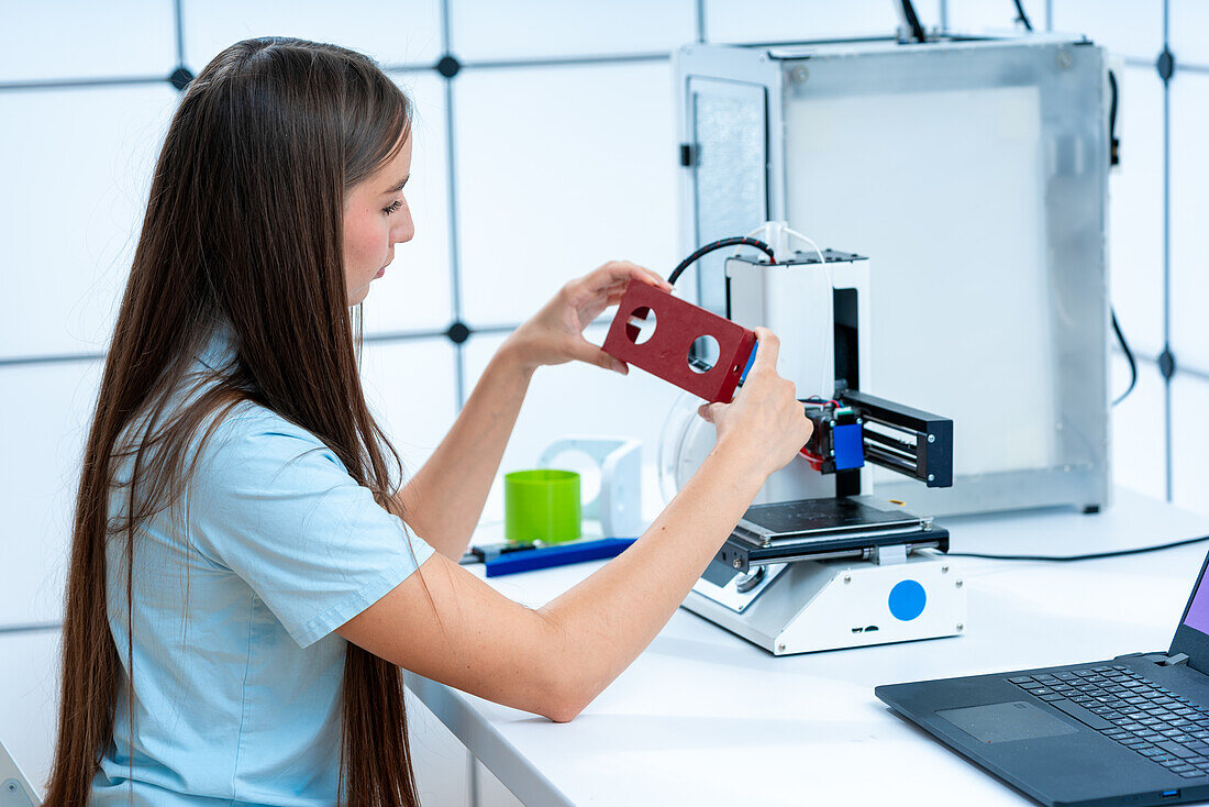 Scientist examining 3D print