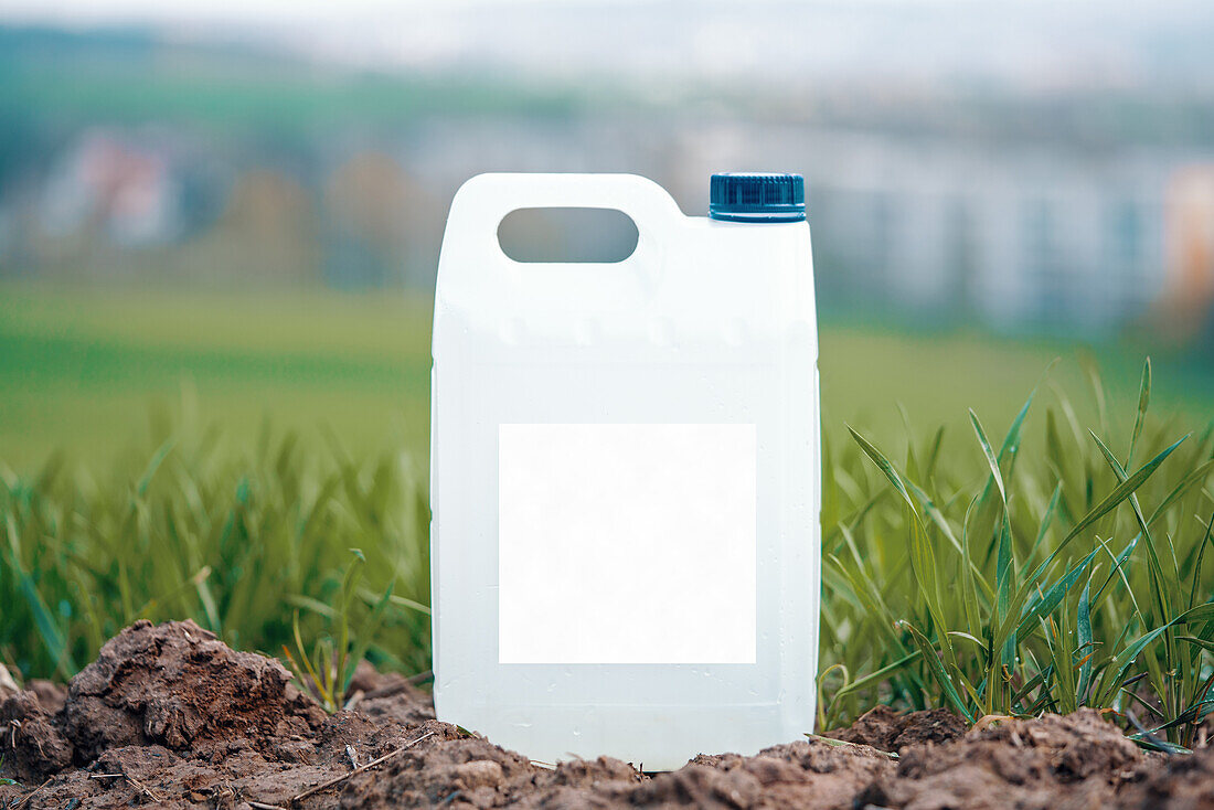 White plastic container with fertiliser
