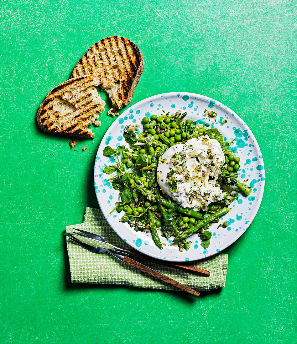 Asparagus and burrata salad with peas and toasted bread