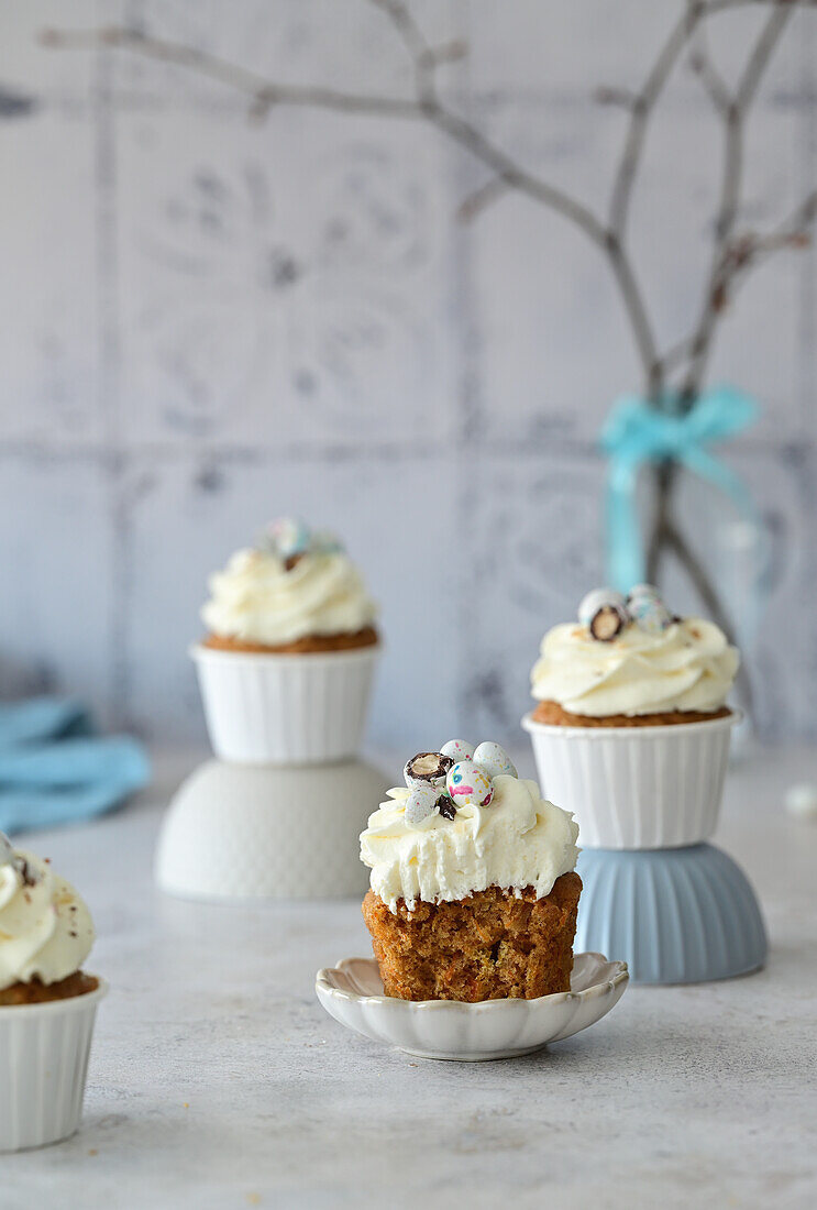 Carrot cupcakes with cream cheese and chocolate eggs