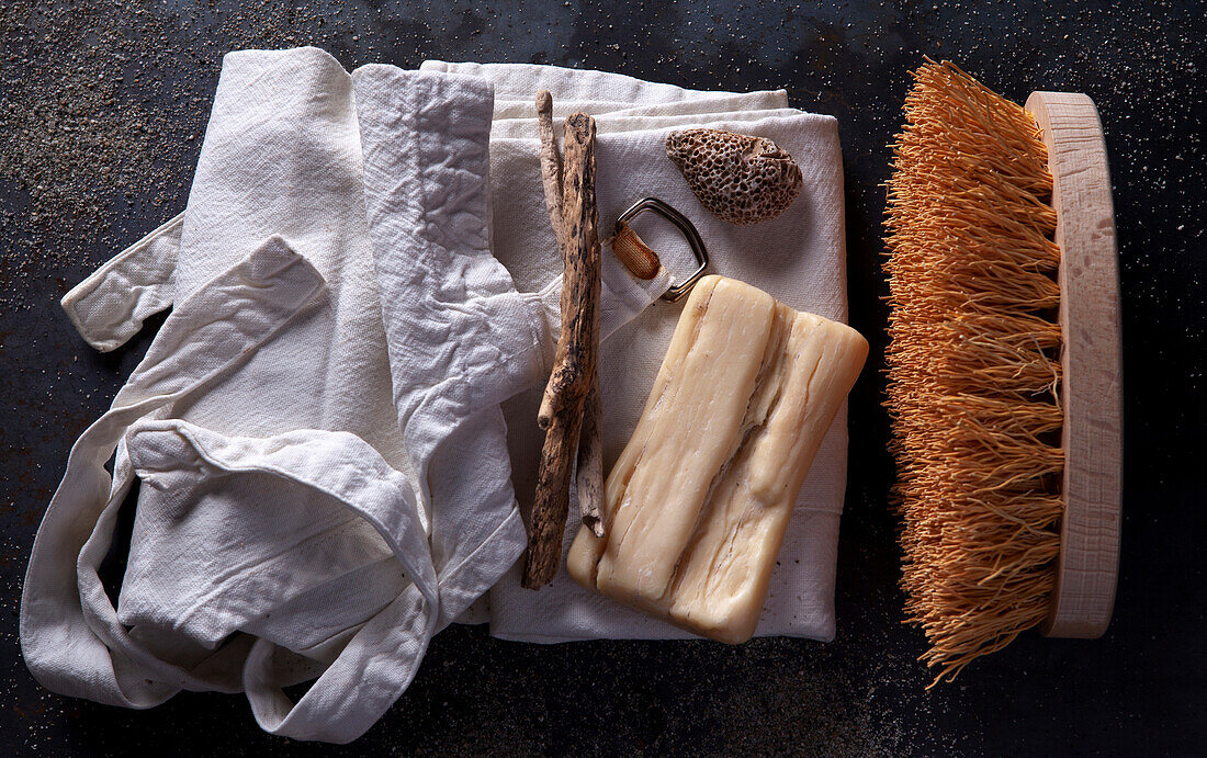 Still life with Marseille soap, brush and cotton apron