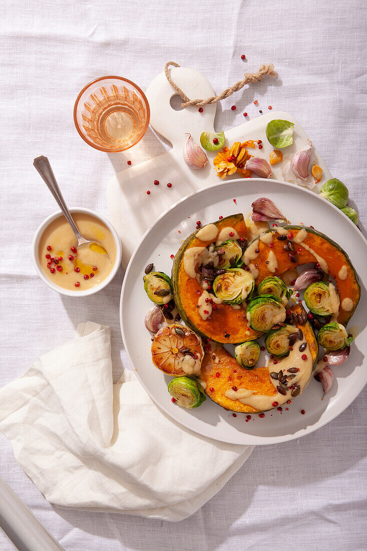 Grilled vegetables with pumpkin slices, Brussels sprouts, garlic and yoghurt-pepper sauce