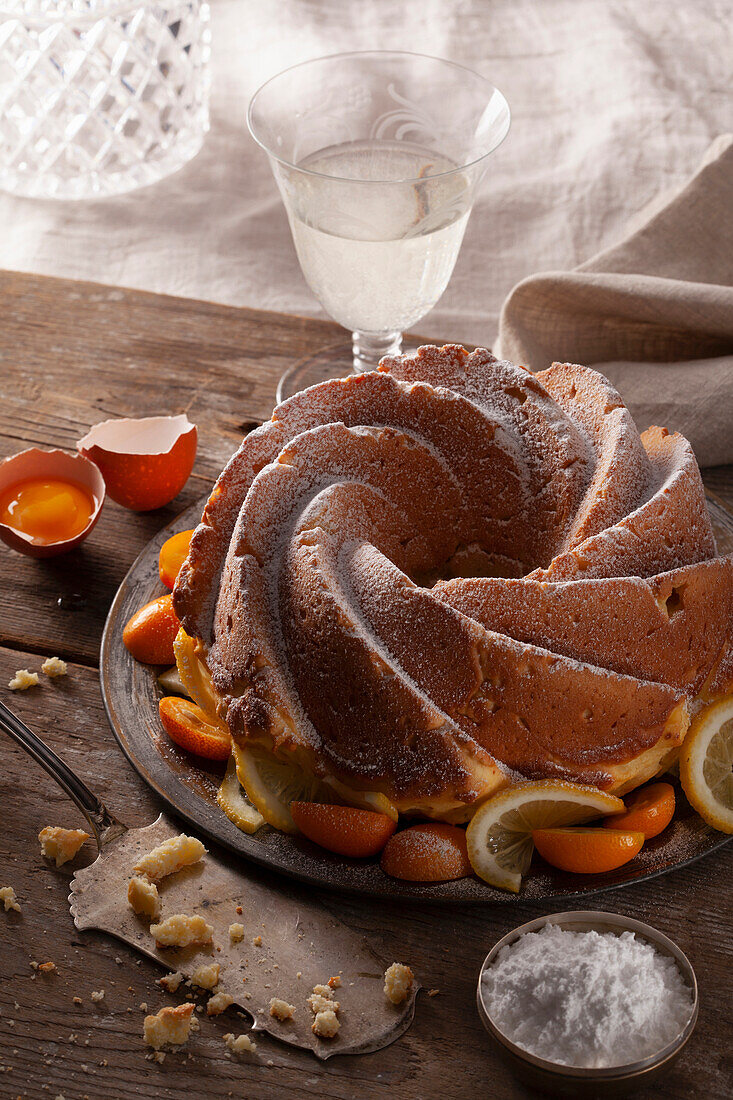 Chiffon cake with citrus fruit and icing sugar