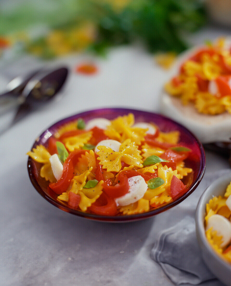 Farfalle with saffron, paprika, goat's cheese and basil