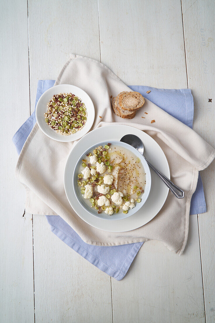 Cauliflower soup with cannellini beans and sprouts