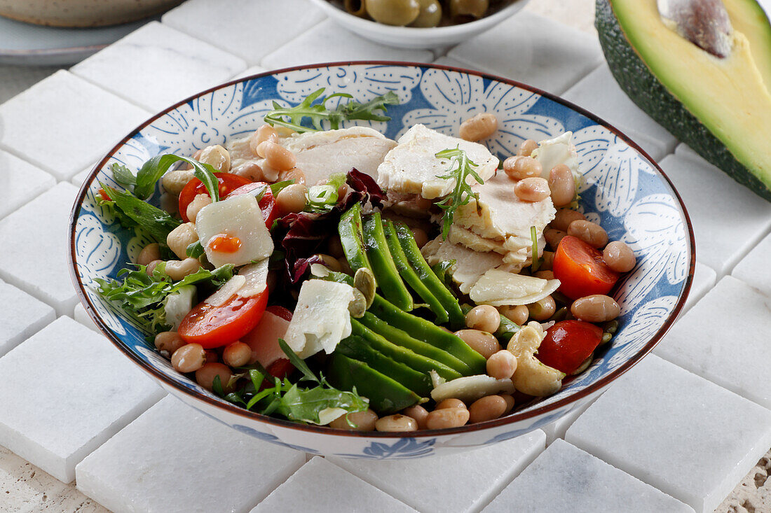 Mixed bean salad with avocado, chicken and feta