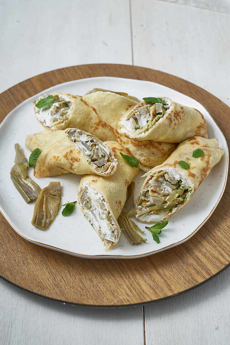 Cannoli with artichoke filling and herbs