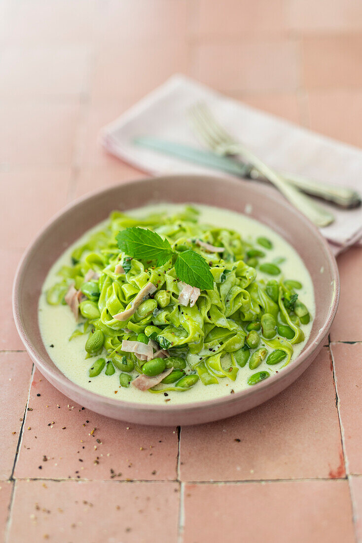 Mint and herb pasta with beans, gorgonzola and cooked ham