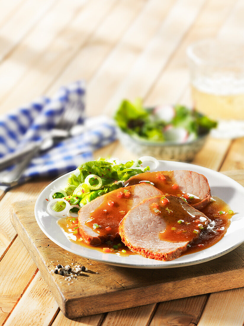 Roast pork with gravy and mixed salad