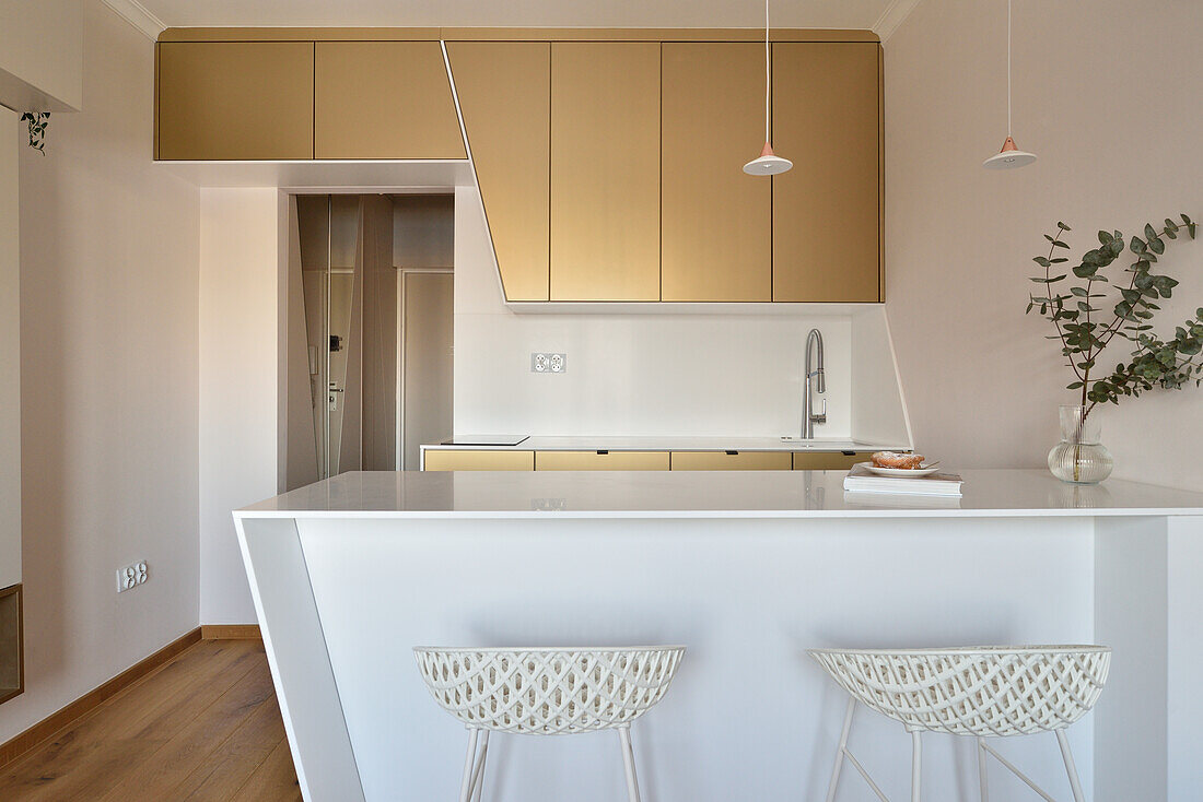 Studio with modern kitchenette and bar stools