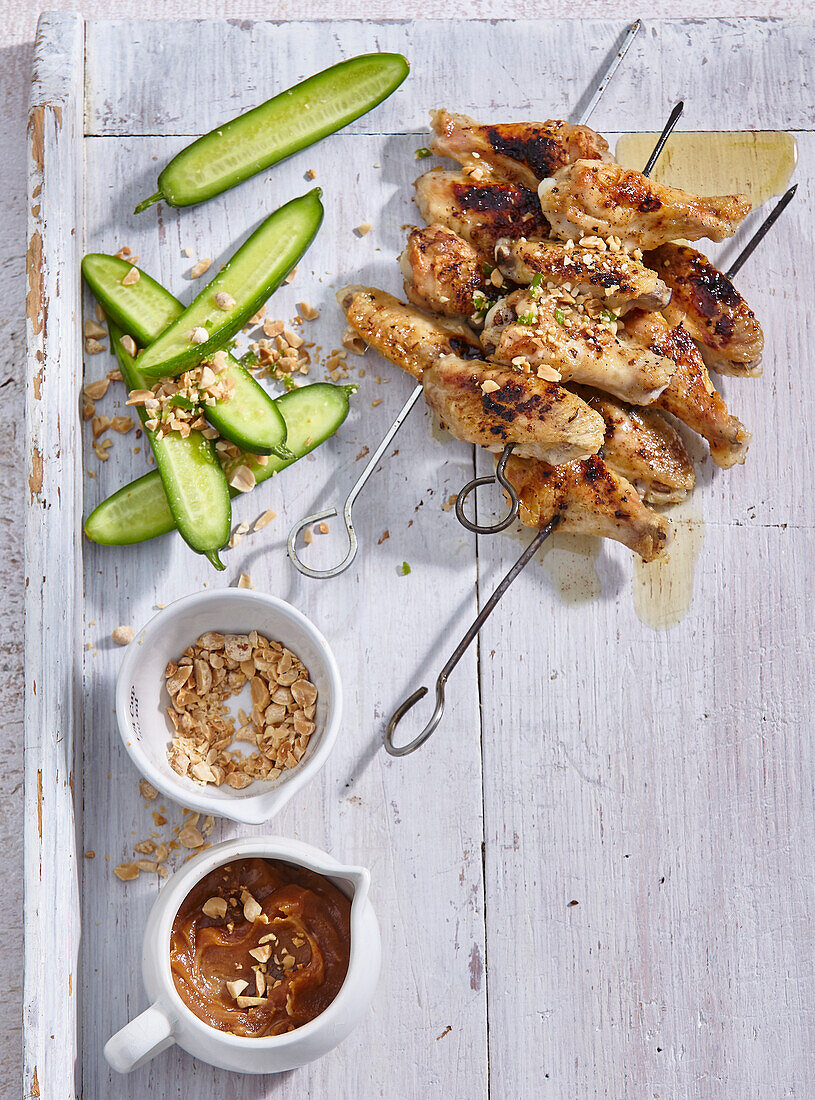Chicken wing skewers with peanut sauce