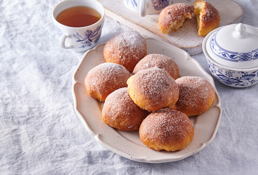 Apple and yeast dough balls with icing sugar