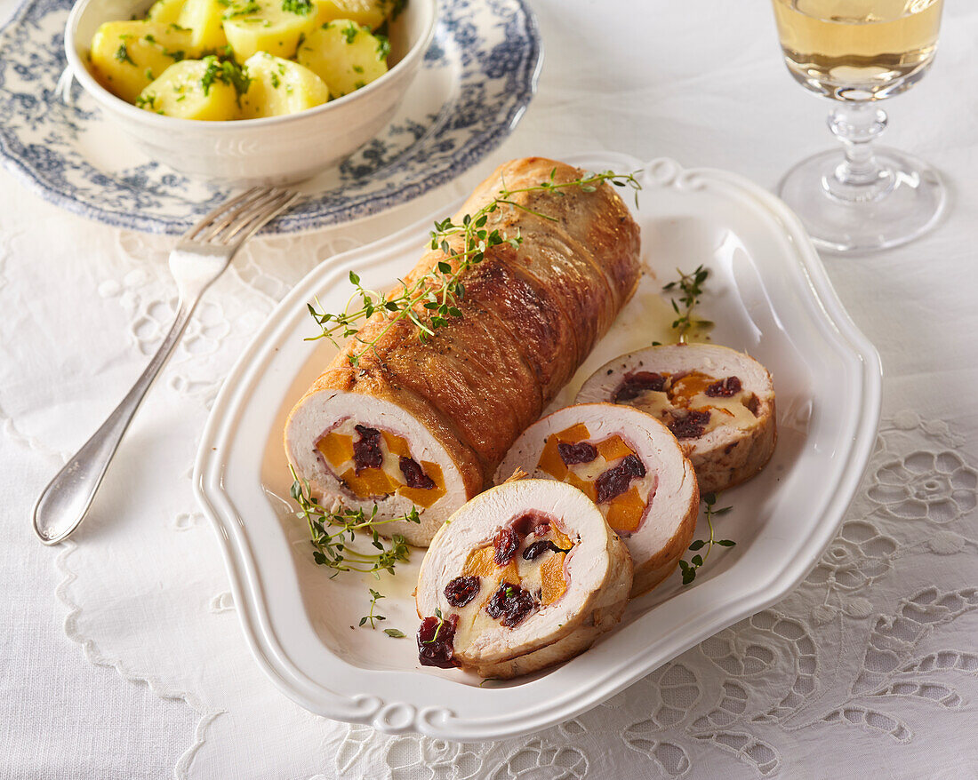 Stuffed turkey roll with pumpkin and cranberries