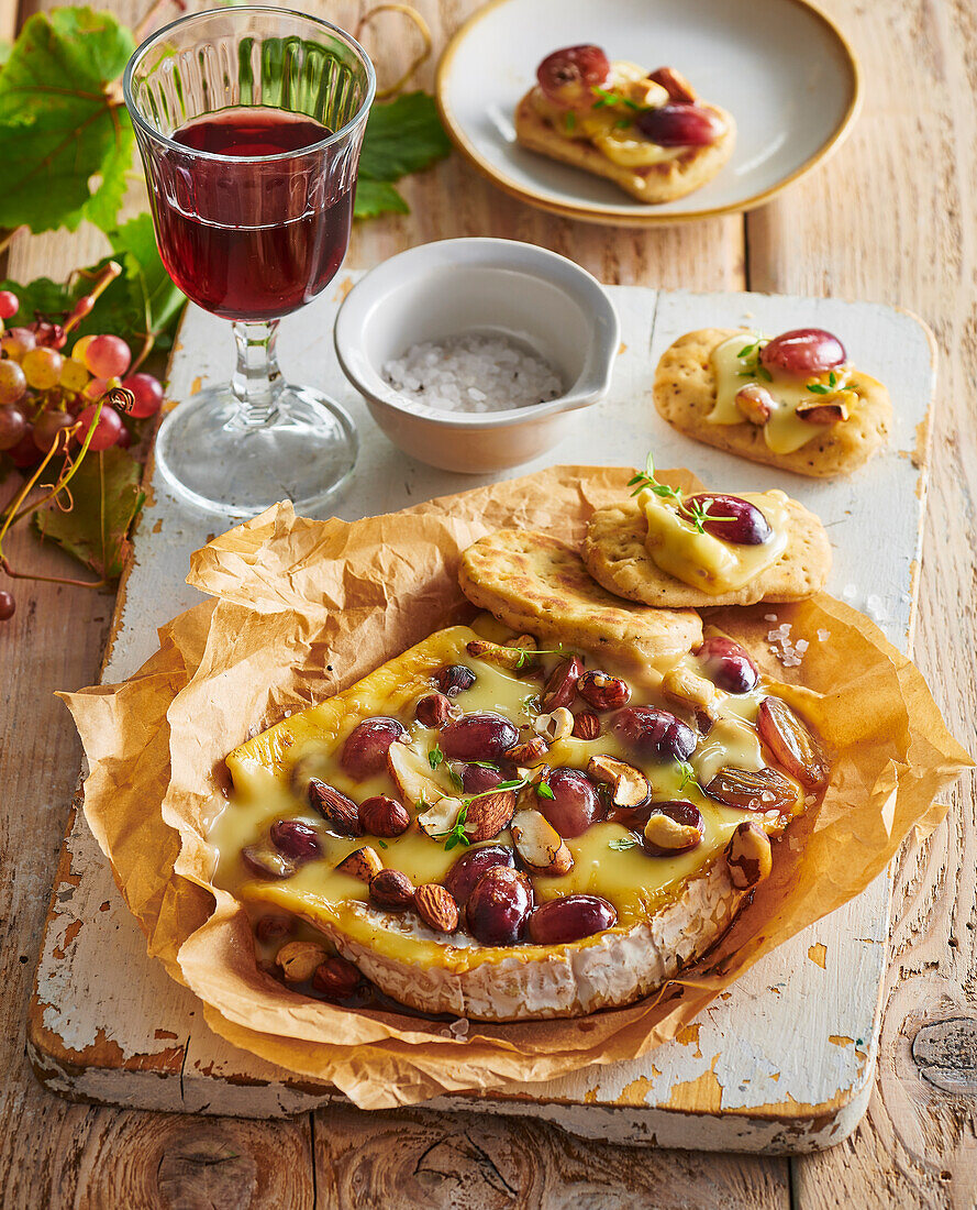 Baked brie with grapes, nuts and homemade crackers