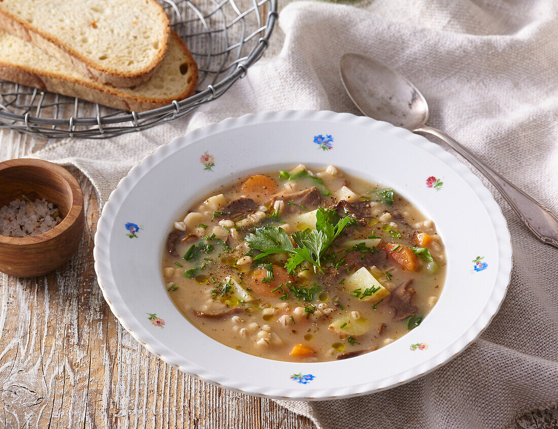 Potato soup with pearl barley and vegetables