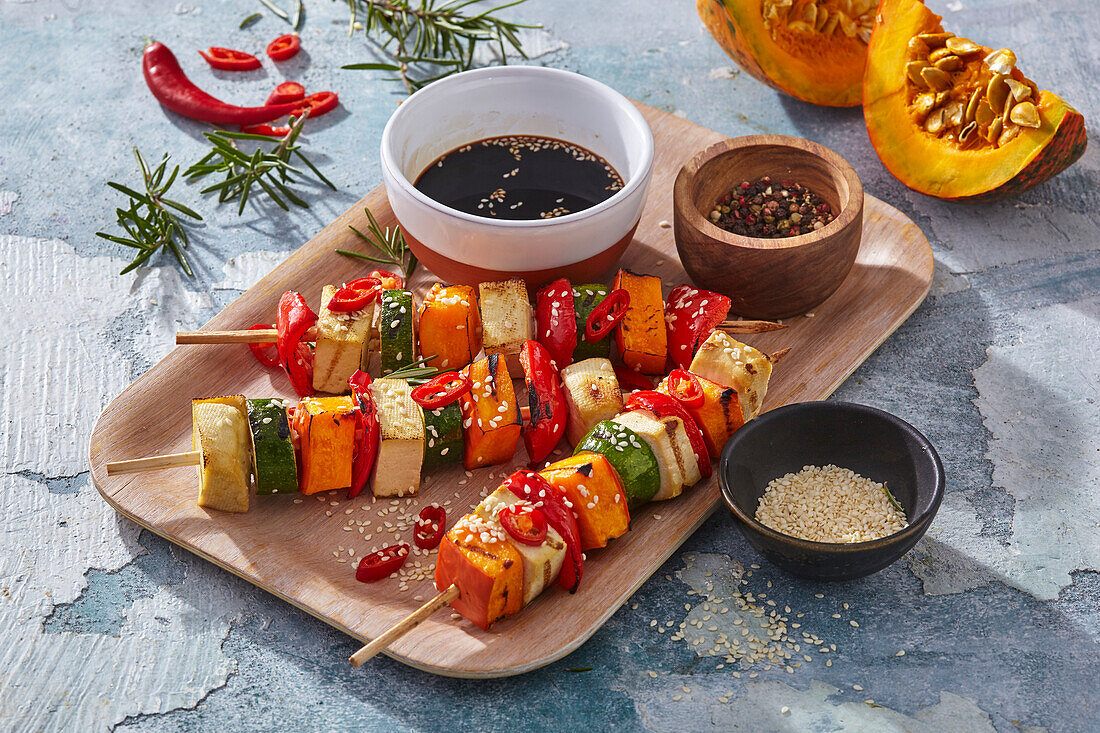 Vegetable skewers with pumpkin, tofu, sesame seeds and soya sauce