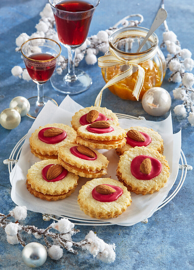 Coconut biscuits with gloss icing and almonds for Christmas