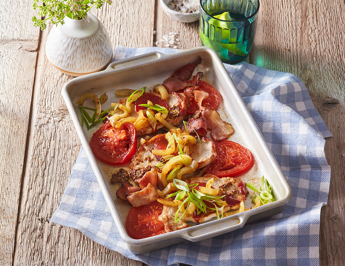 Baked pork chops with bacon and tomatoes