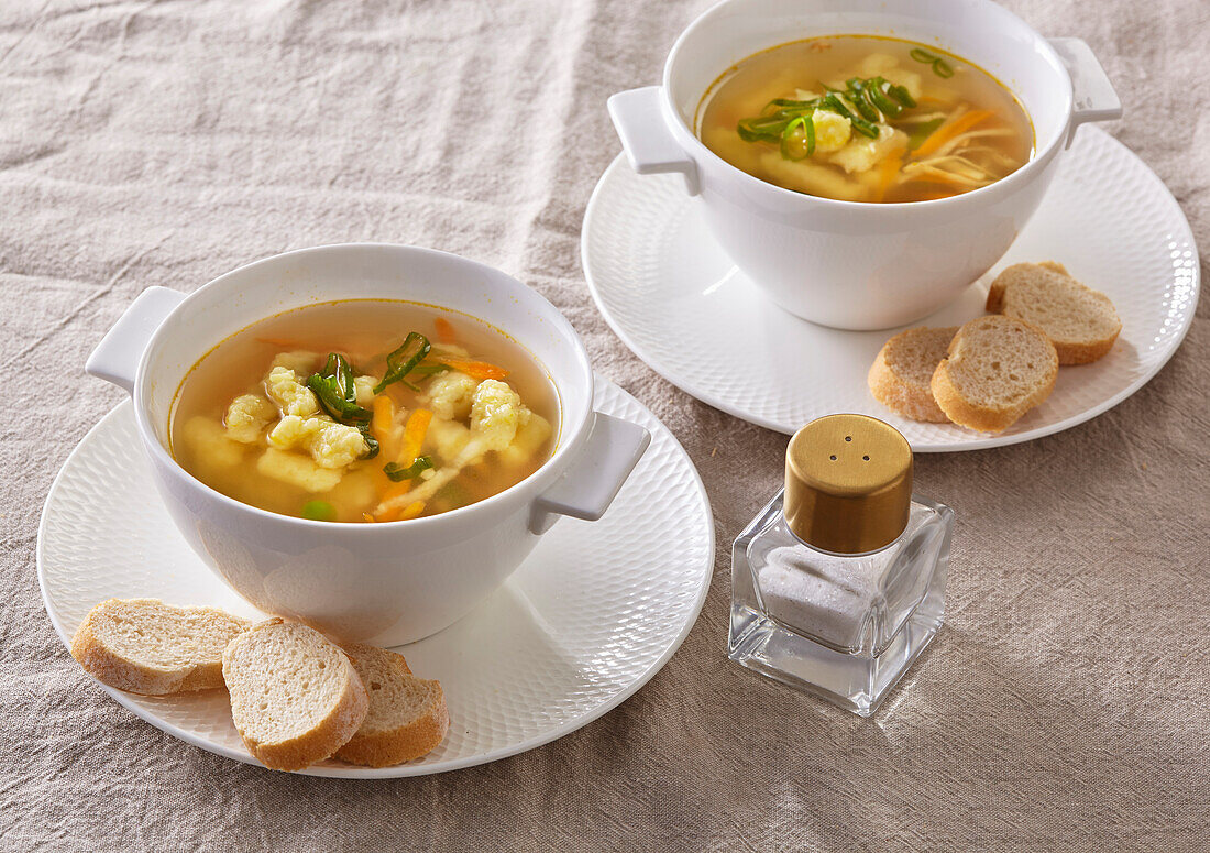 Vegetable soup with potato gnocchi, carrots and peas