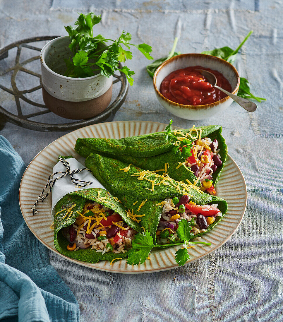 Spinach wraps with rice, tomatoes, sweetcorn and cheddar cheese
