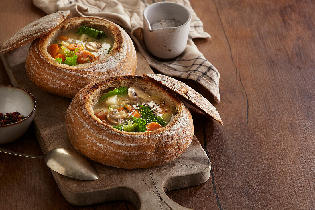 Vegetable soup in a hollowed-out loaf of bread