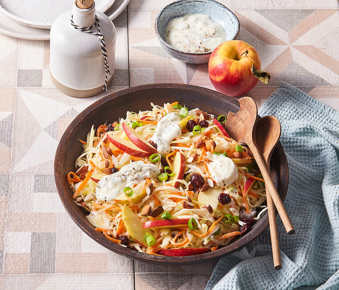 Winter salad with white cabbage, apples, carrots and cranberries