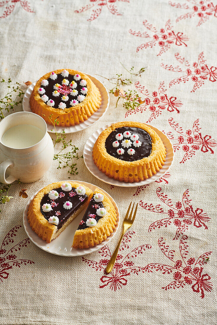 Sponge cake with chocolate and dots of cream