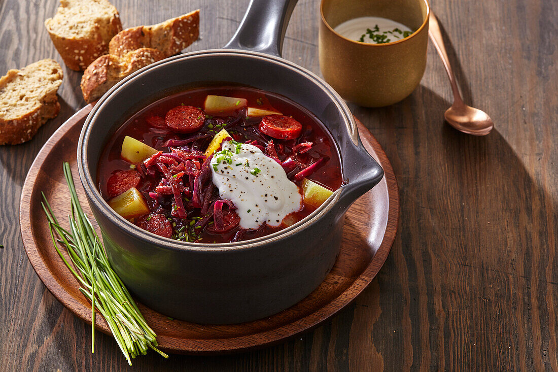 Beetroot soup with sausage and sour cream