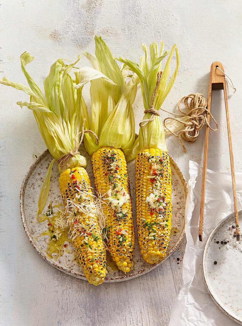 Grilled sweetcorn with herb butter and parmesan