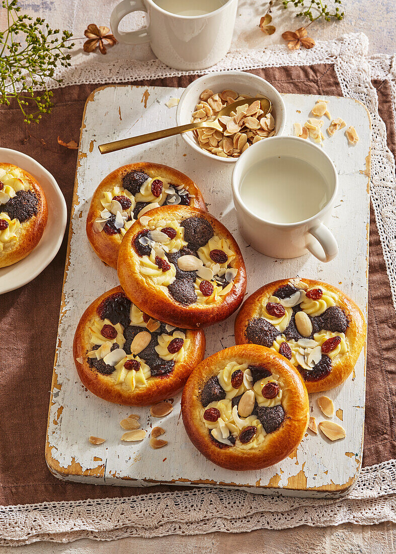 Yeast dough tartlets with quark and poppy seed filling and nuts