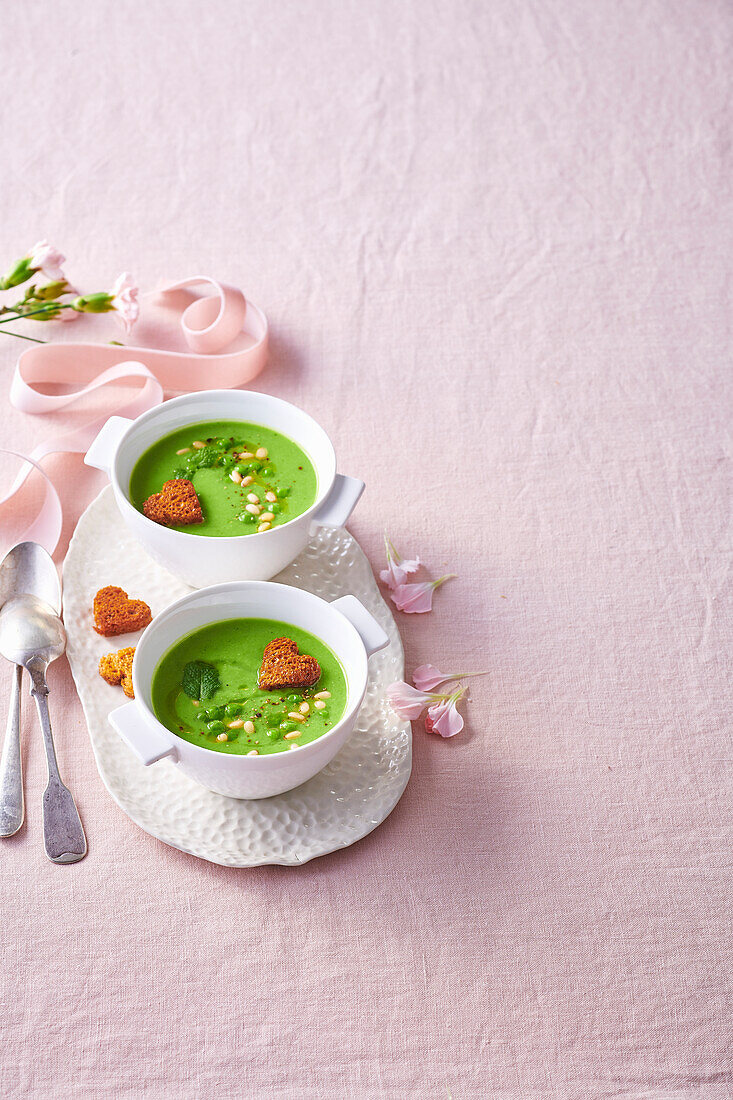 Pea soup with mint, pine nuts and heart-shaped croutons