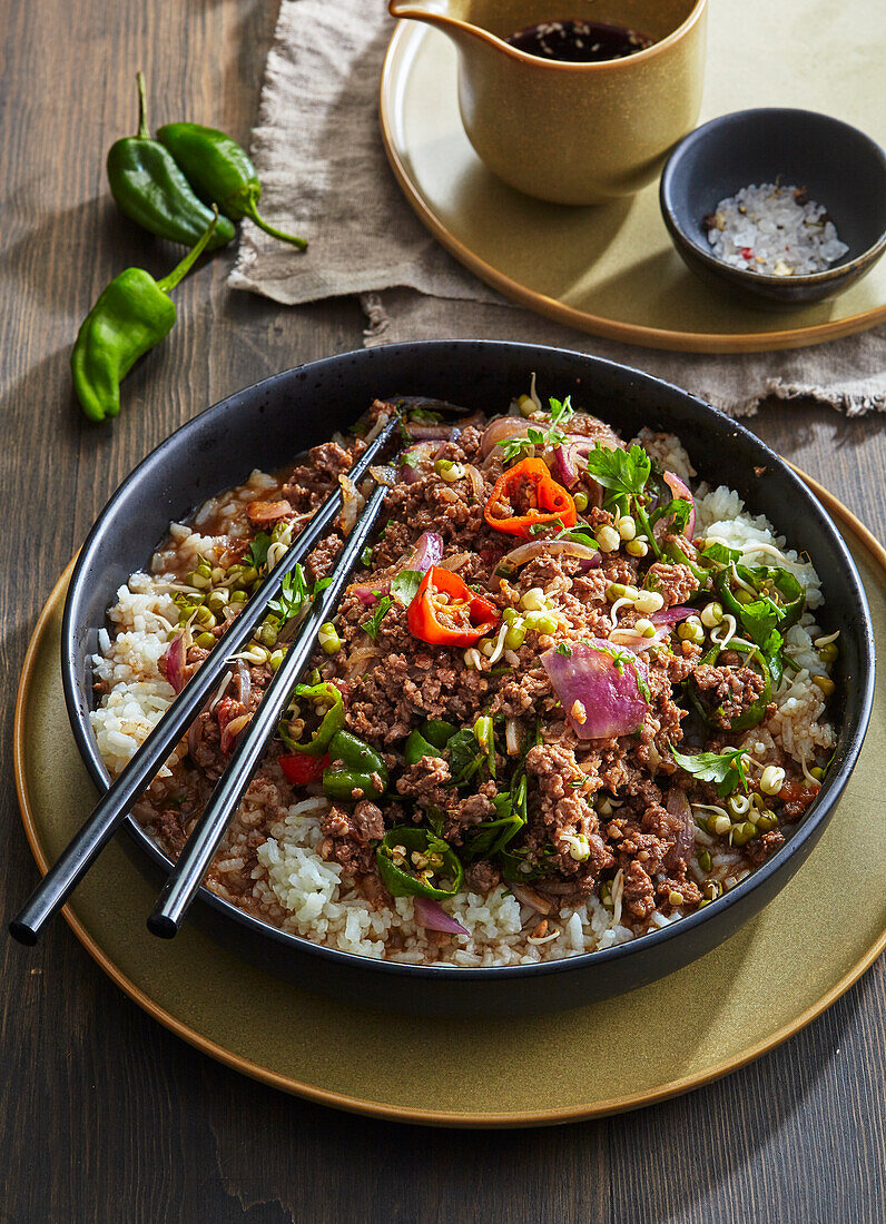 Korean spicy beef stir-fry with rice and chillies