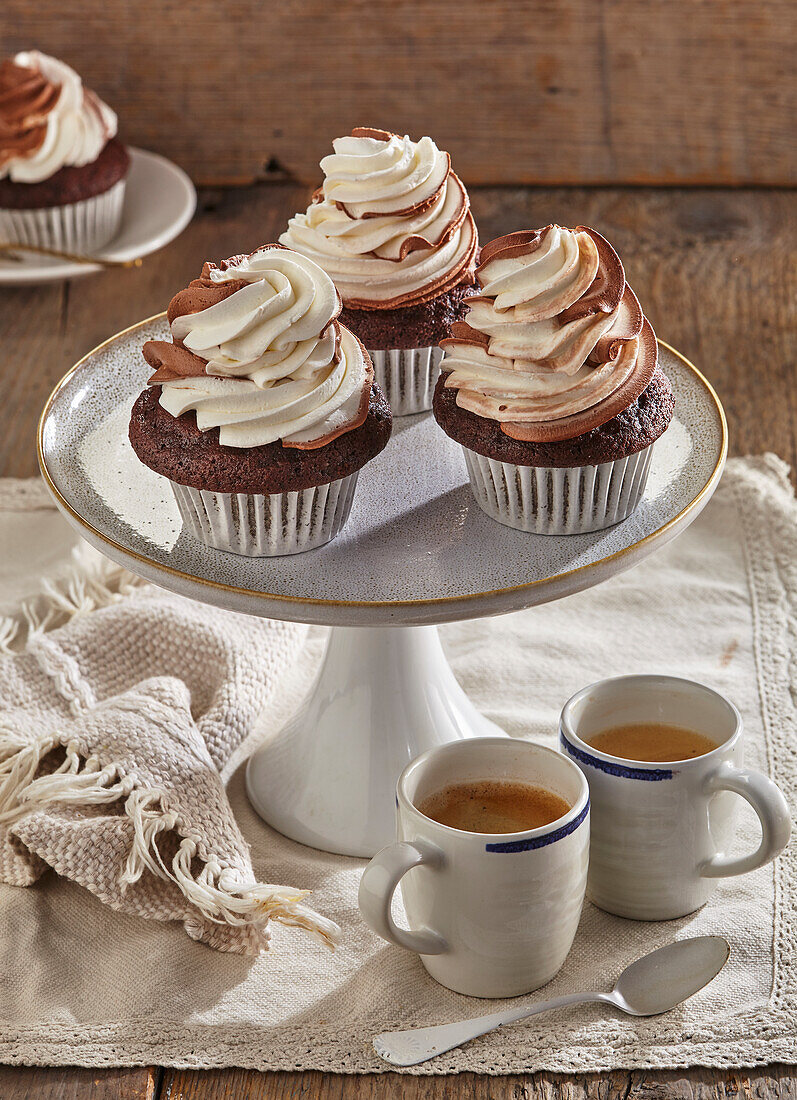 Gluten-free chocolate cupcakes with whipped cream topping