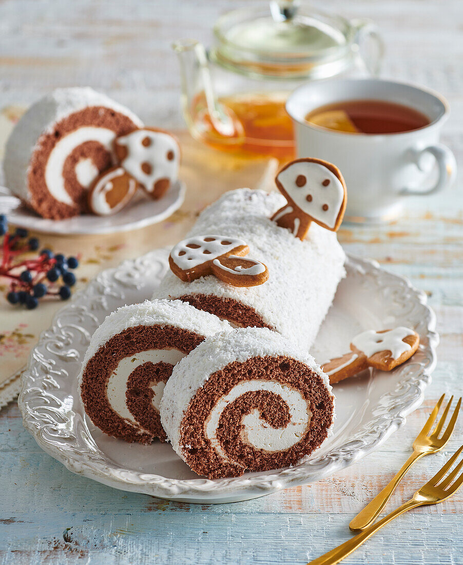 Chocolate sponge roll with coconut flakes and gingerbread biscuits
