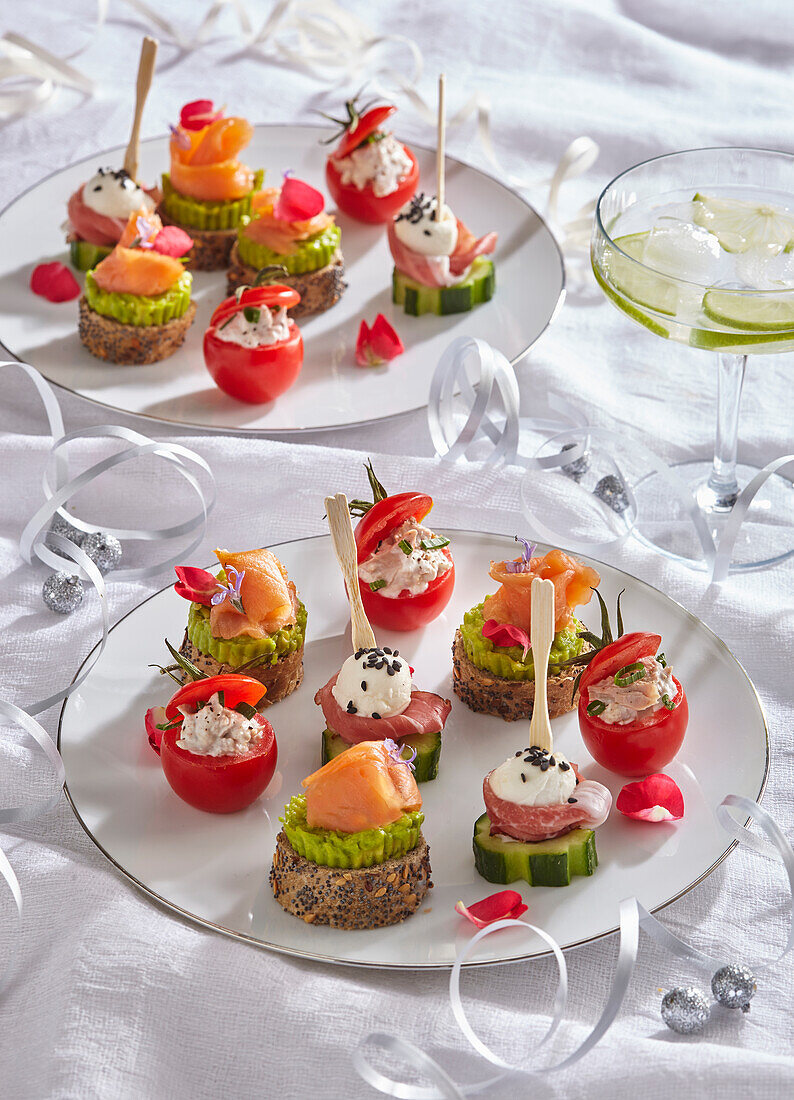 Canapé plate with salmon, ham and vegetables