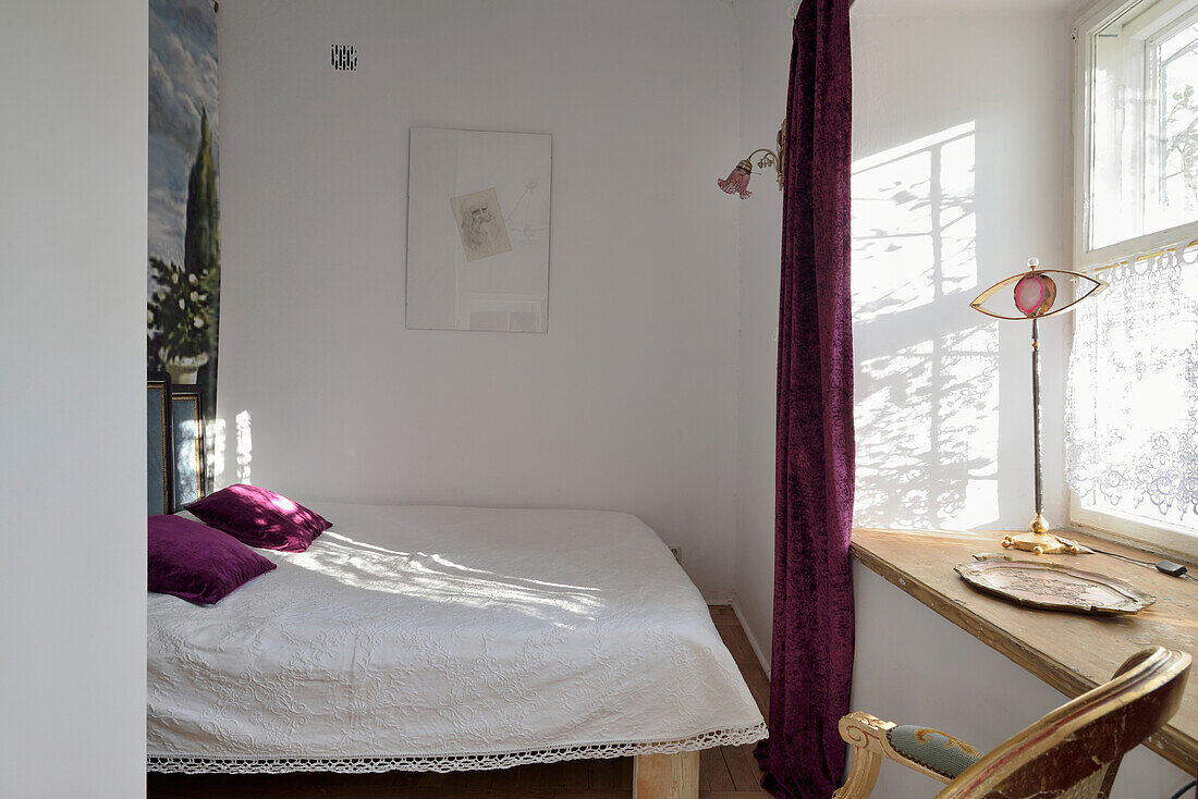 Bedroom with wooden furniture and purple accents