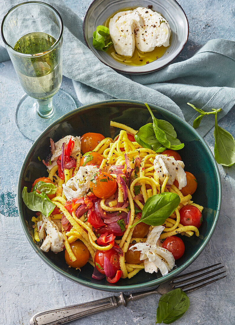 Caprese spaetzle with tomatoes, basil and mozzarella