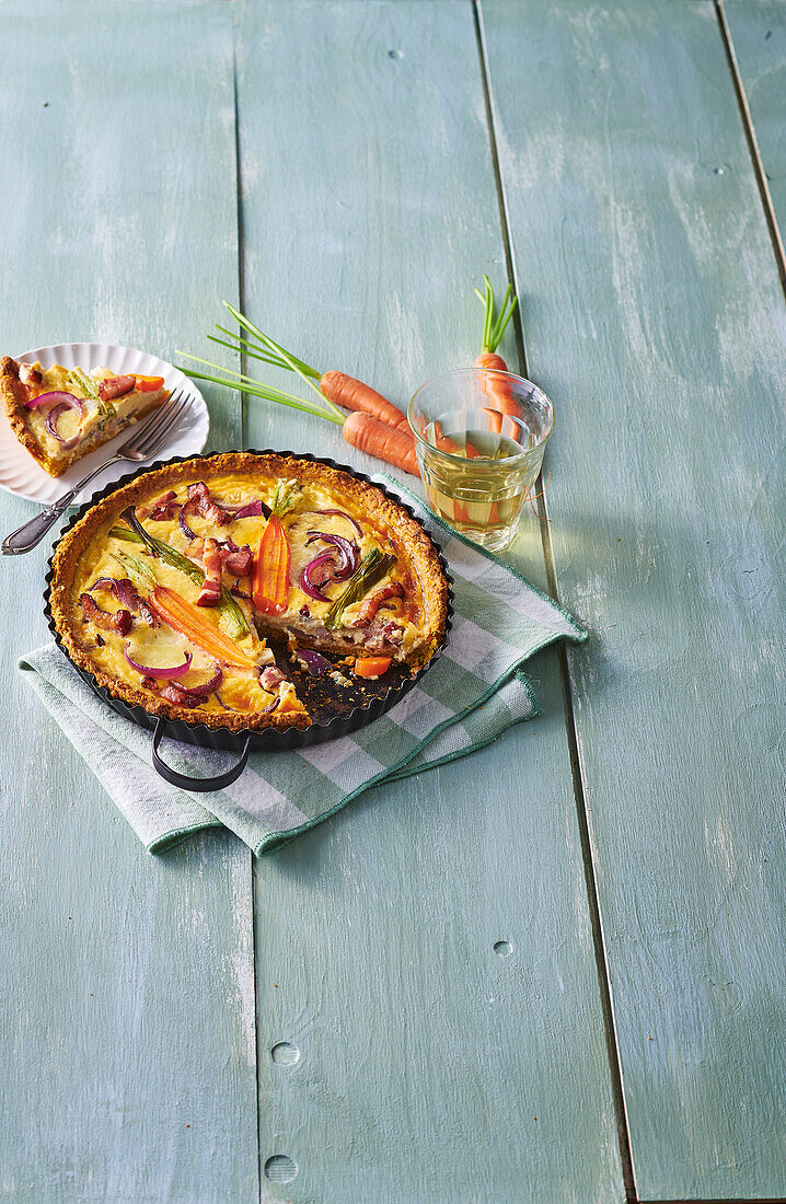 Carrot quiche with pancetta and spring onions