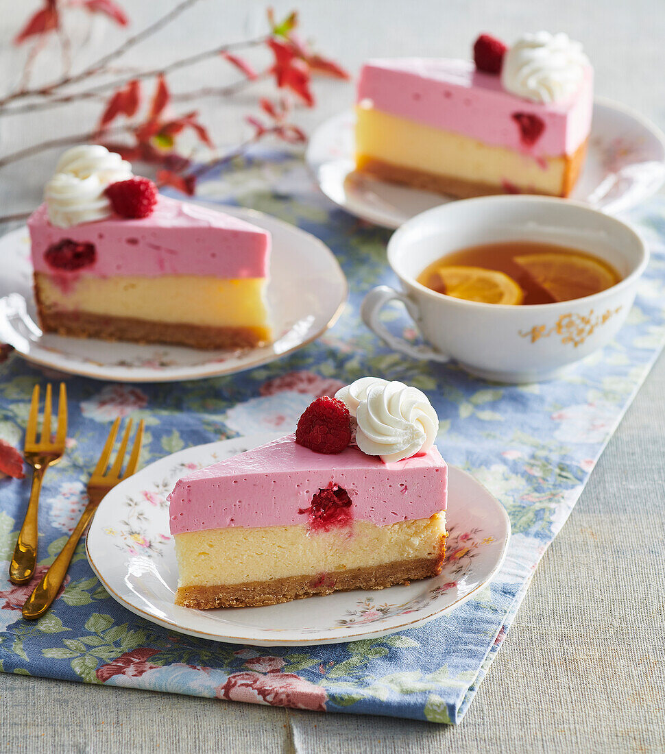 Raspberry mousse cheesecake with dots of cream