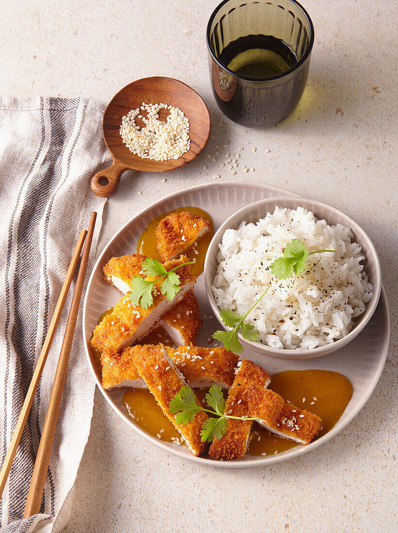 Breaded chicken with curry sauce and rice