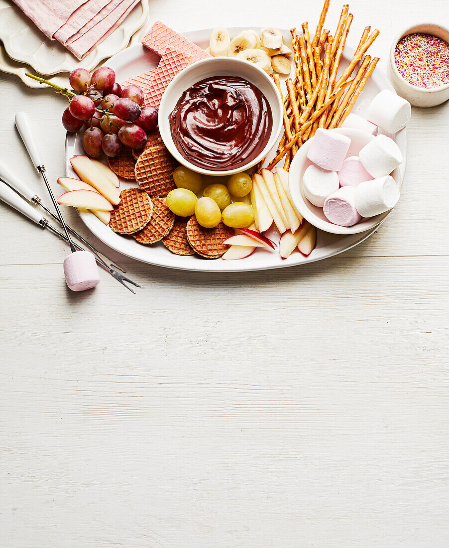 Chocolate fondue with fruit and sweets