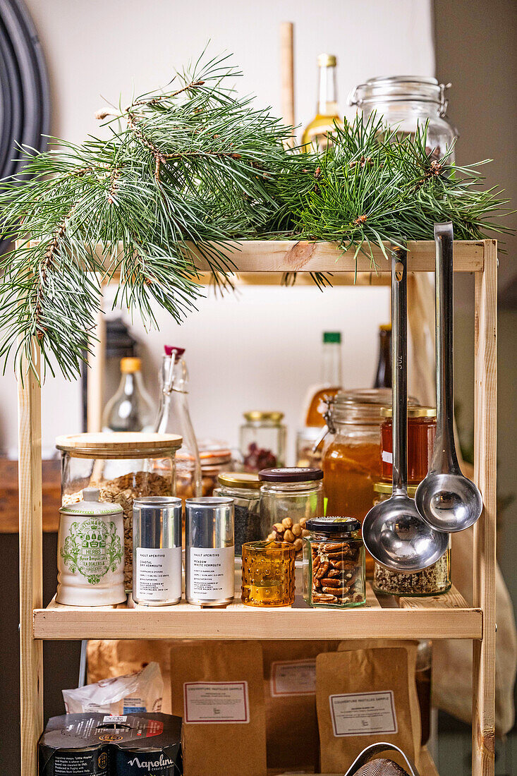 Shelf with spices and kitchen utensils