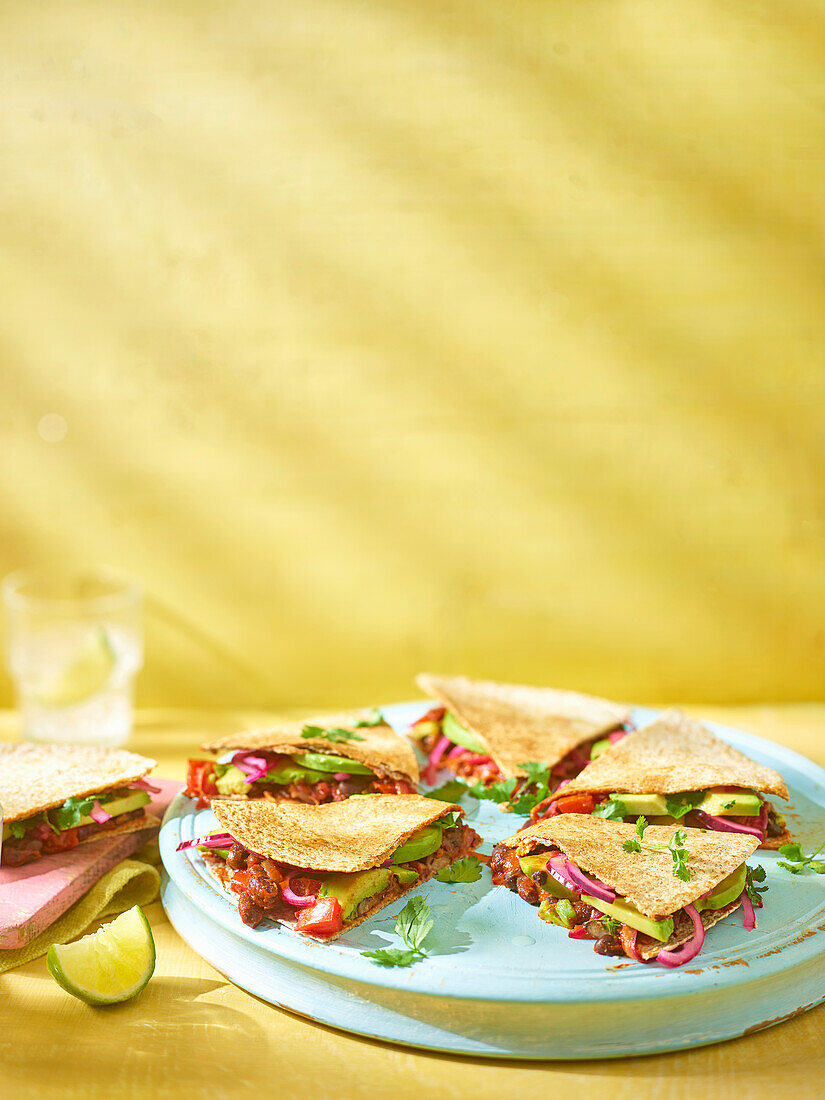 Quesadillas with spicy beans and avocado