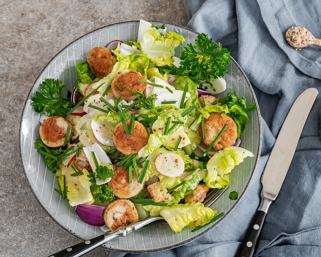 Salad with grilled prawns, egg and herbs