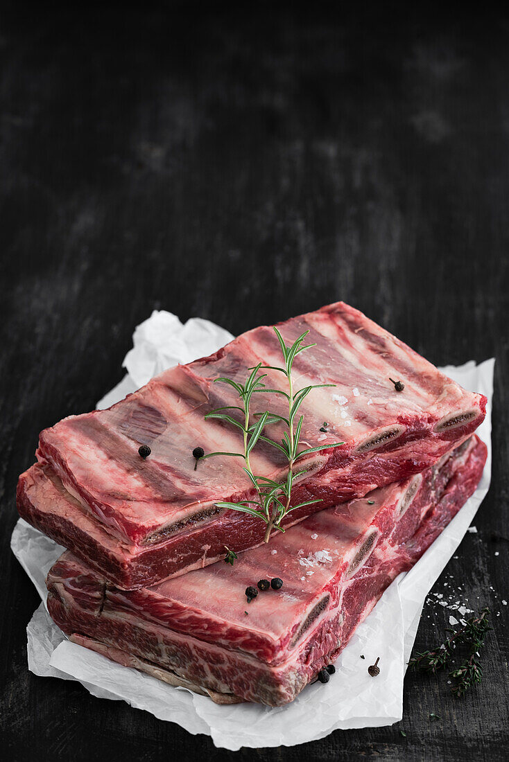 Raw beef ribs with rosemary and spices