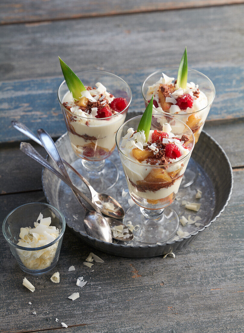 Layered dessert with pineapple and raspberries 'Tropical'