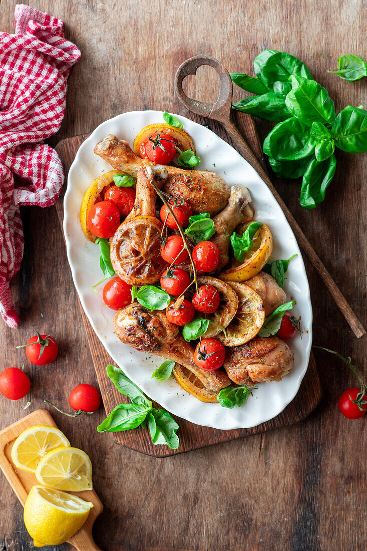 Roasted chicken thighs with lemon and cherry tomatoes