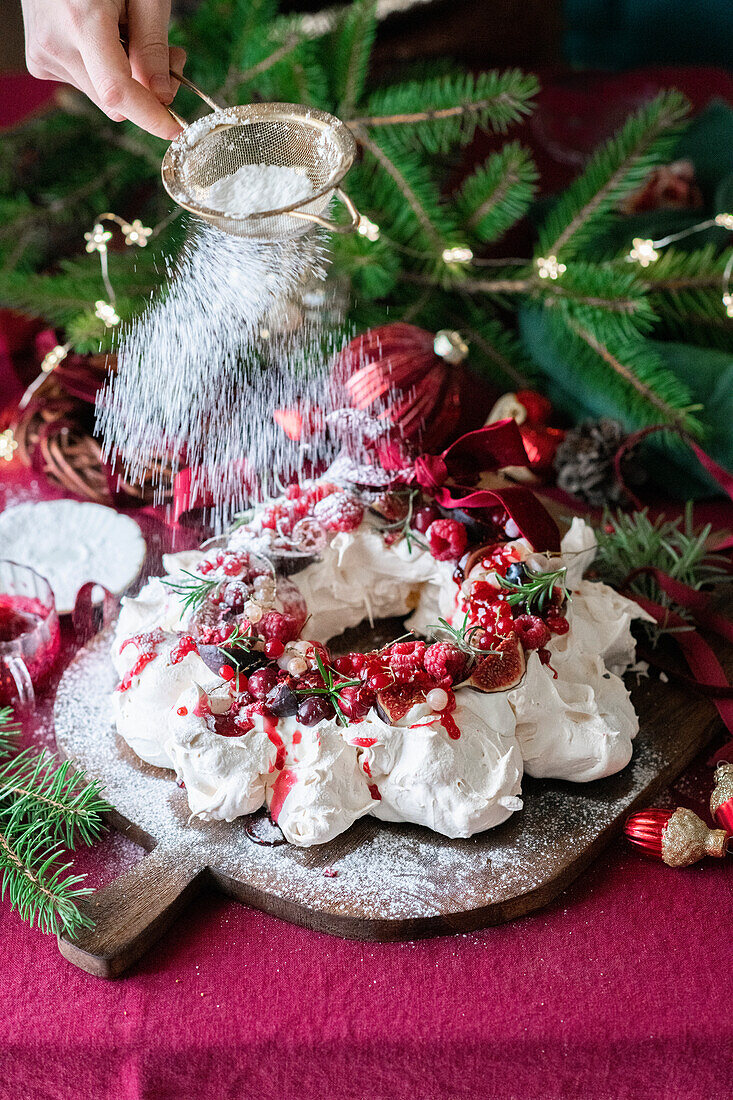 Meringue wreath cake with berries for Christmas