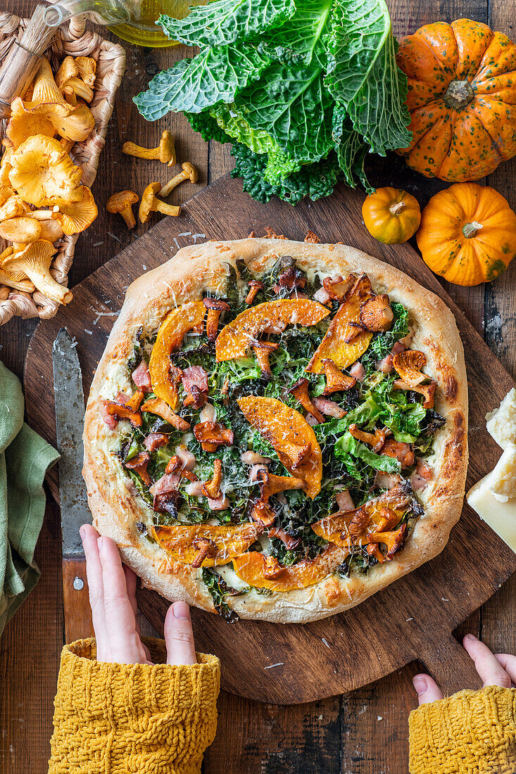 Pumpkin and savoy cabbage pizza with ham and mushrooms