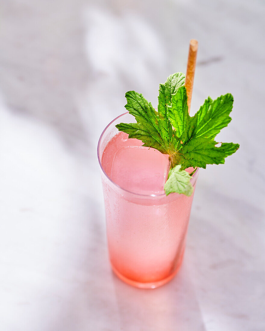 Cocktail with vodka, lime juice and raspberry syrup